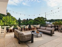 Le Miner Fernand-Trudeau Terrace with lounge areas and BBQs 