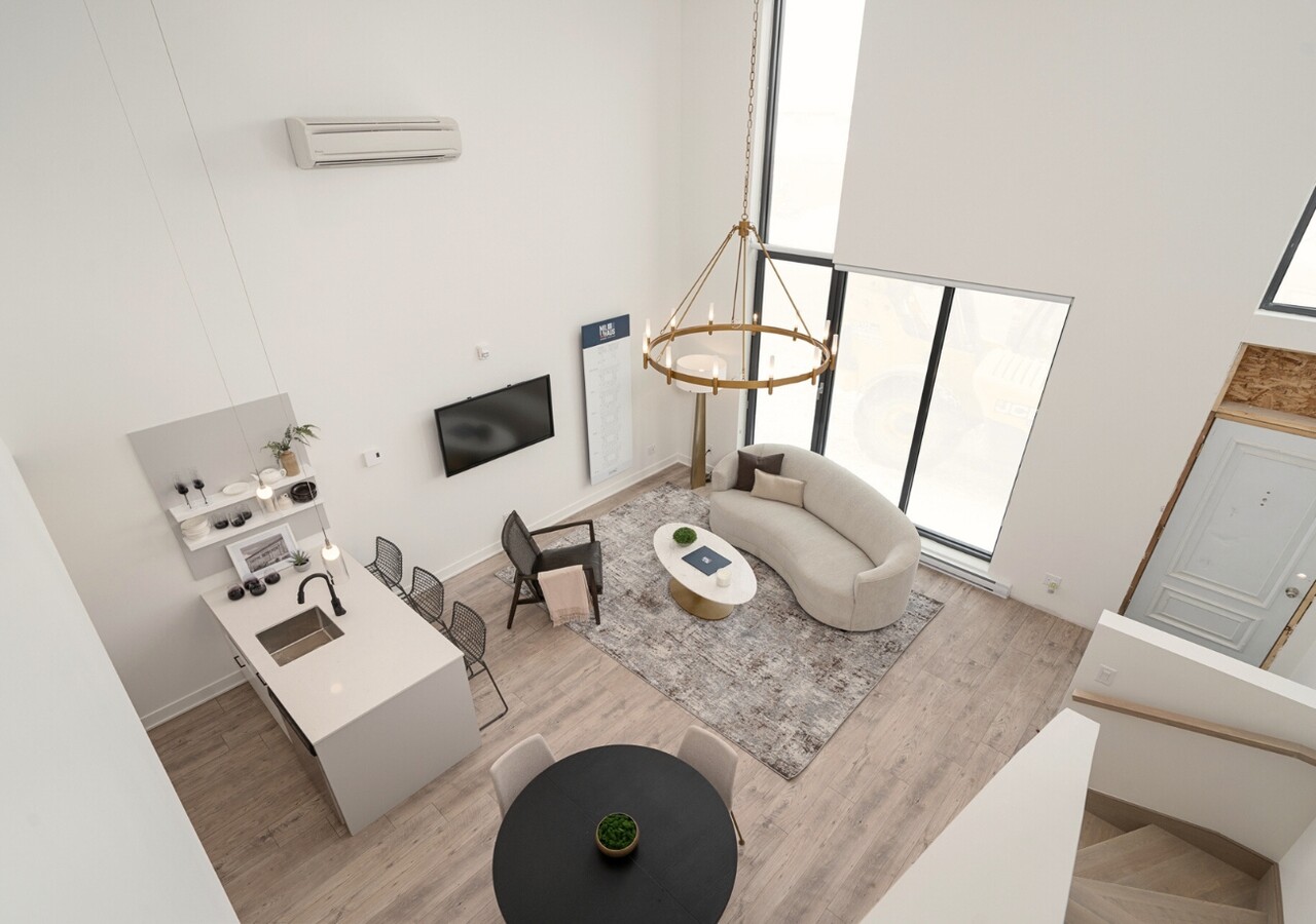 Milhaus Condos salon hauts plafonds